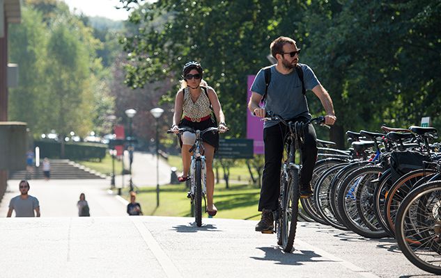Students cycling on Sussex campus