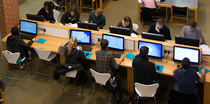 Students working at computers in the University library