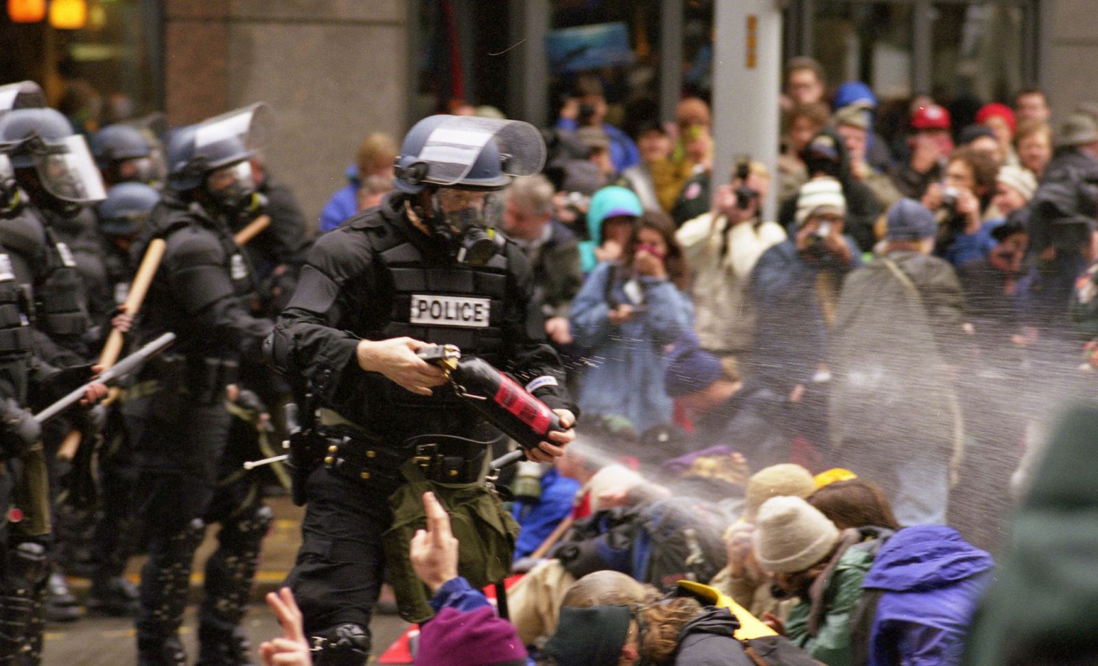 Police pepper spray anti-WTO protesters in Seattle in November 1999